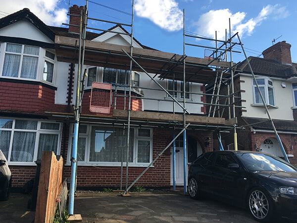 home covered with scaffold