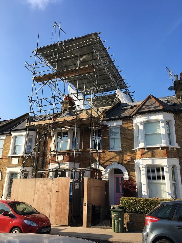 House covered with scaffold