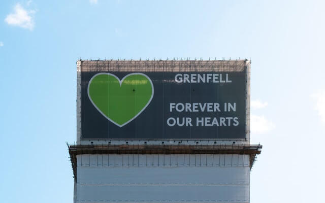 Grenfell tower covered with scaffolding cover