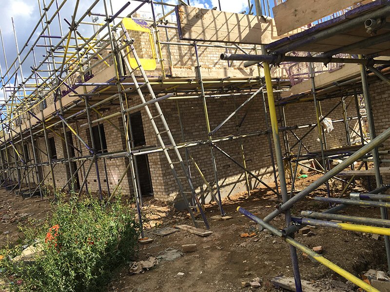 Construction site covered with a scaffold