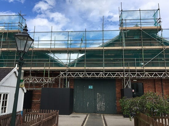 scaffold covered with green netting