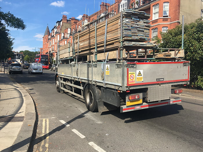 truck loaded with scaffold board and planks