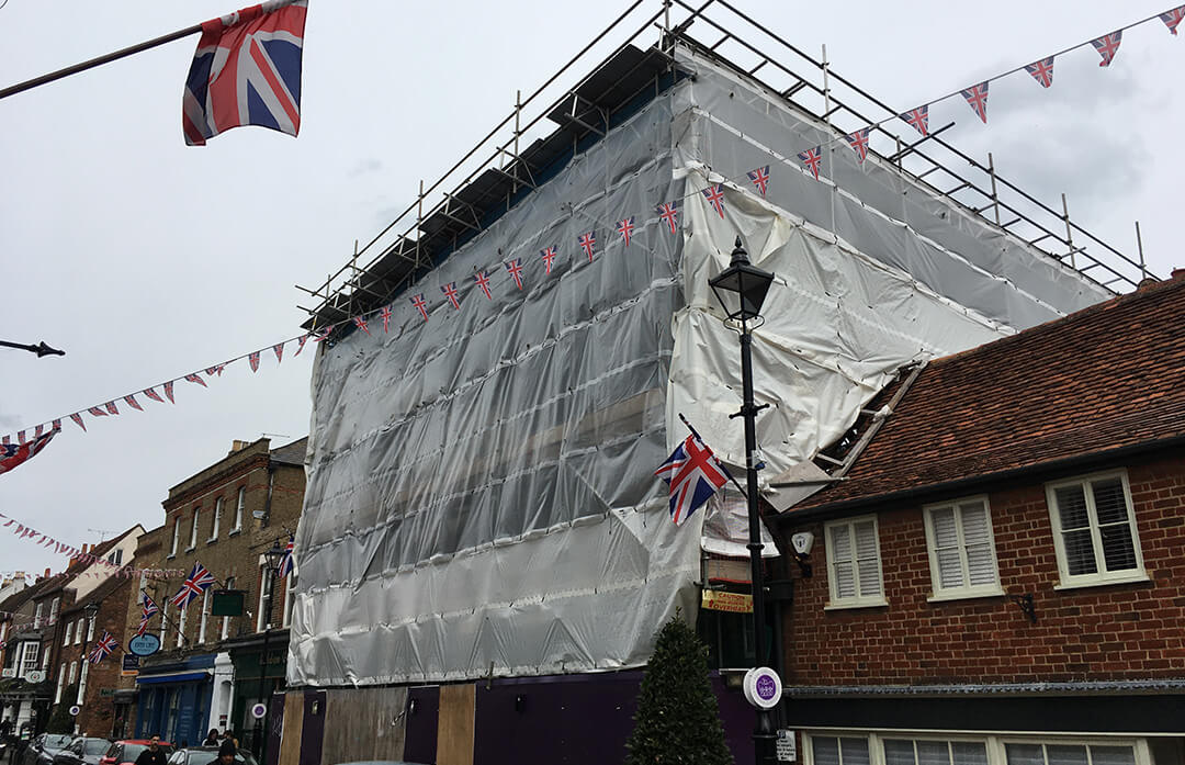 scaffolding covered in white sheeting.