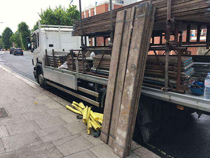 Plank next to lorry