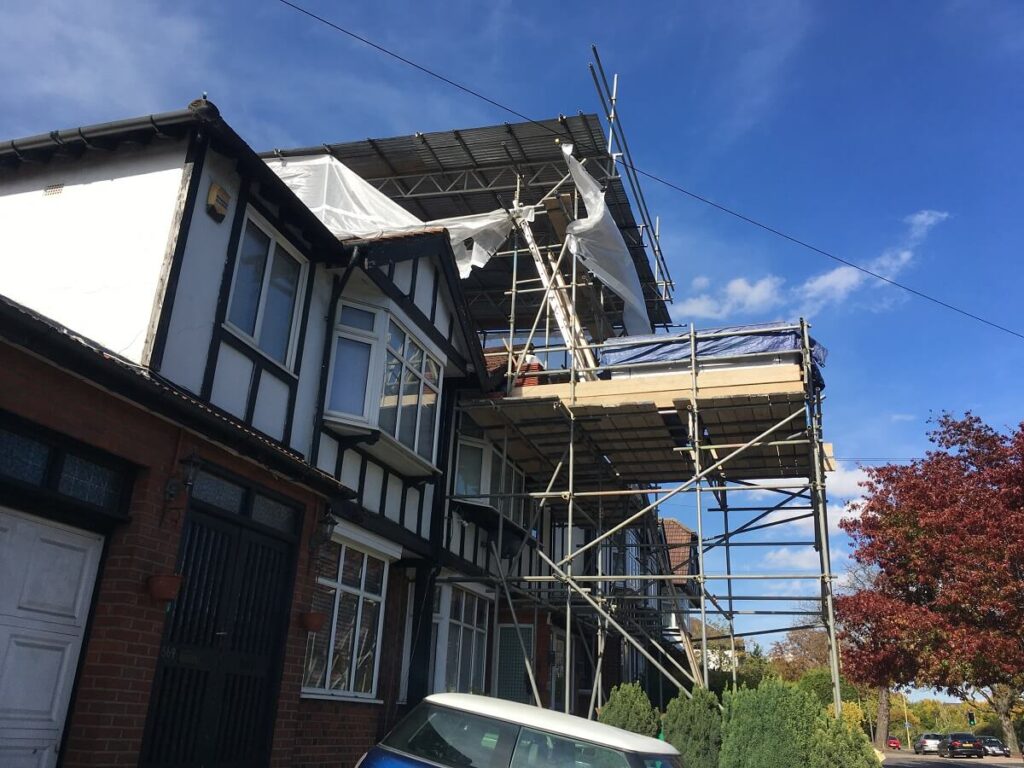 scaffold on a roof with a loading bay