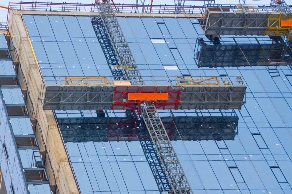 wide mast climber on a skyrise construction site