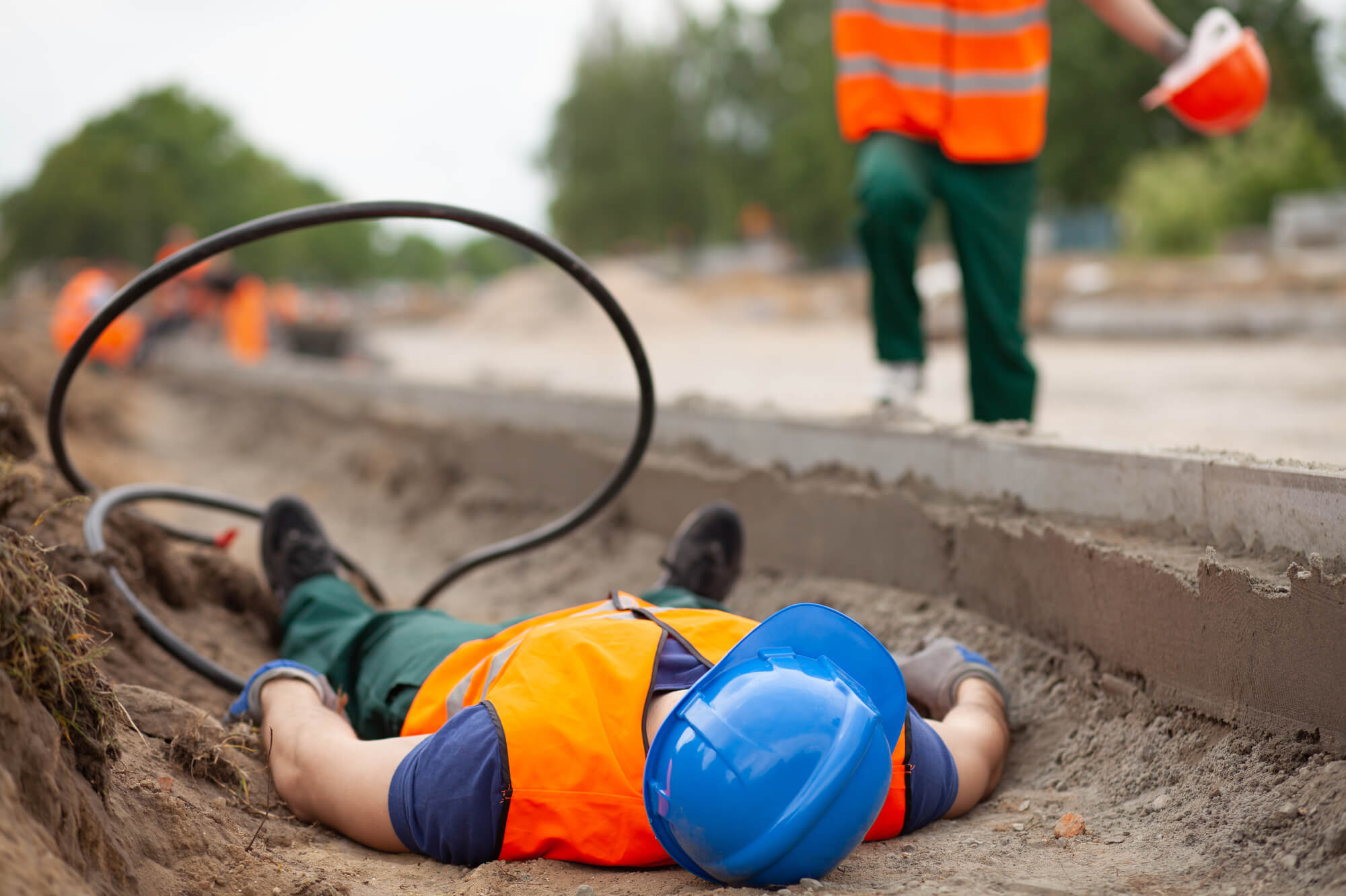 Builder laying on ground